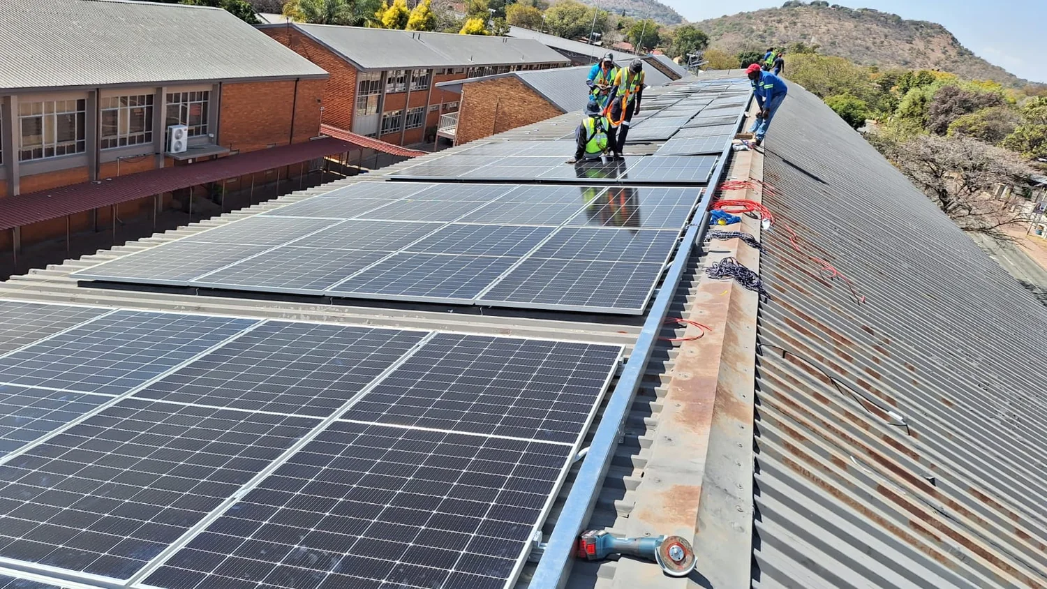 MSNT team installing a commercial rooftop solar array