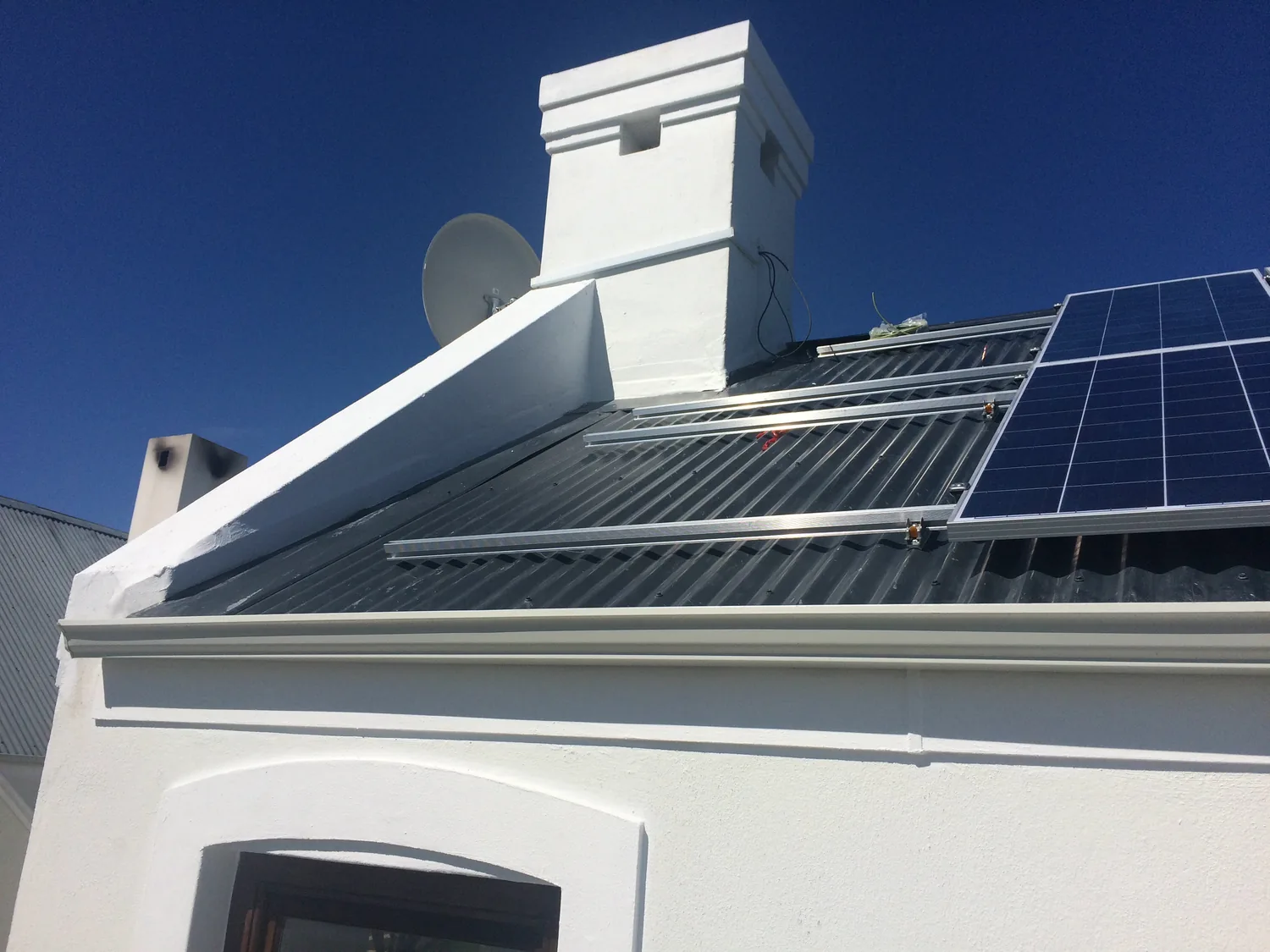 MSNT installer fitting solar panels on a residential roof in Cape Town